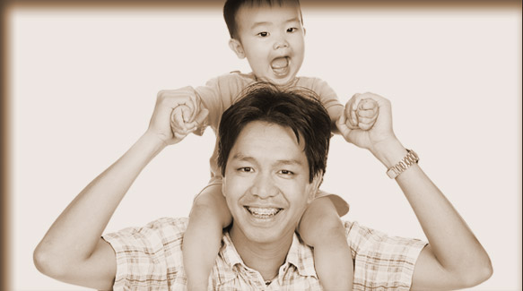 smiling father and son with braces