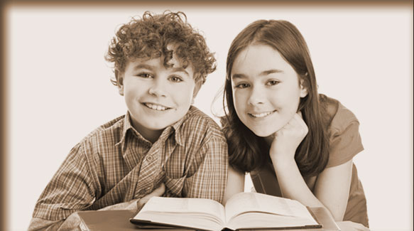 smiling girl and boy with books