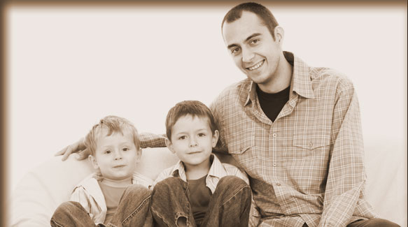 smiling father and sons